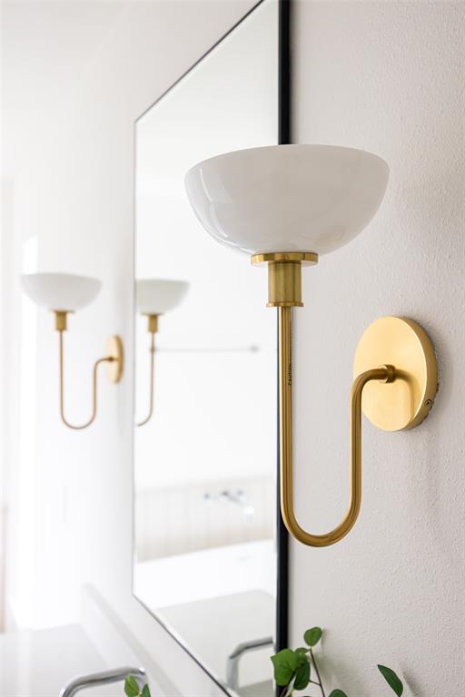 16805 Deer Park Drive Dallas, TX 75248 - Photo 30 of 39 a bathroom with a sink and a mirror