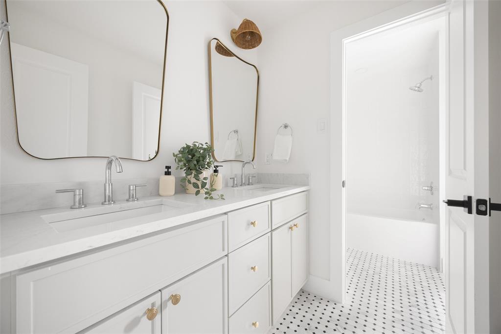 16805 Deer Park Drive Dallas, TX 75248 - Photo 34 of 39 a bathroom with a sink and a mirror