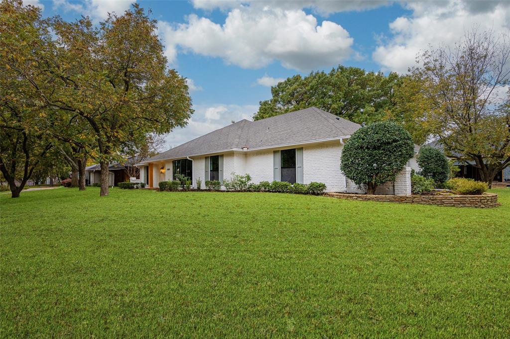 16805 Deer Park Drive Dallas, TX 75248 - Photo 37 of 39 a front view of a house with a garden