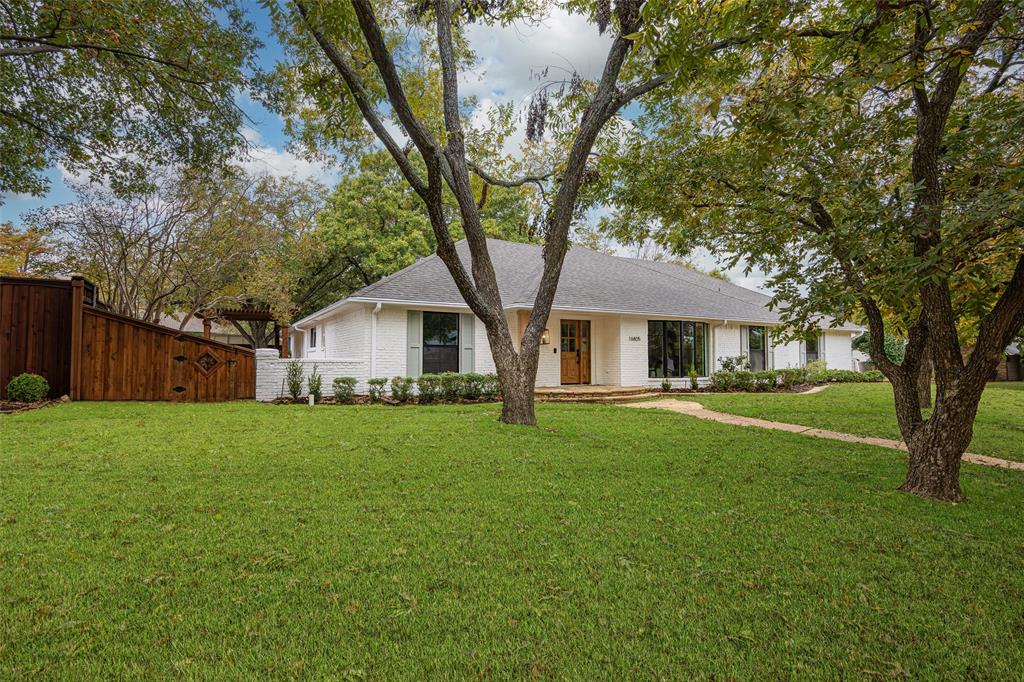 16805 Deer Park Drive Dallas, TX 75248 - Photo 6 of 39 a front view of a house with yard and green space