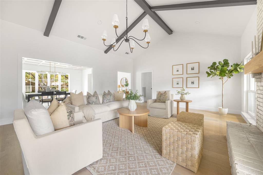 16805 Deer Park Drive Dallas, TX 75248 - Photo 9 of 39 a living room with furniture and a chandelier