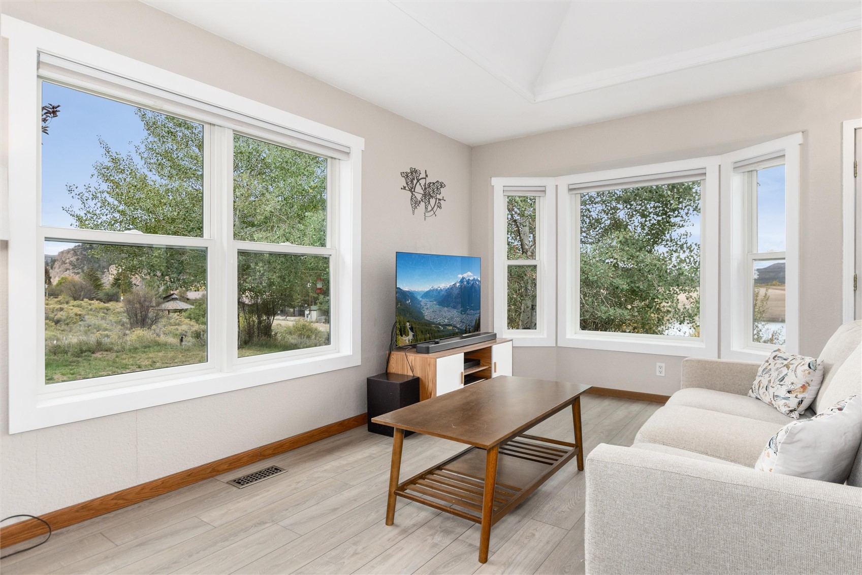 11 Blue Ridge Street Heeney, CO 80498 - Photo 16 of 45 A lush lakeside landscape features prominently out of the living room windows.