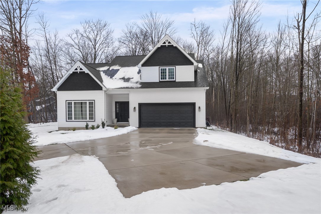 39600 Aurora Road Solon, OH 44139 - Photo 3 of 49 View of front of property featuring an attached garage and concrete driveway