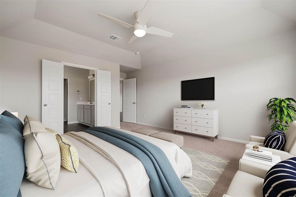 2103 Spring Hollow Drive Baytown, TX 77521 - Photo 14 of 27 a bedroom with a bed tv and chair