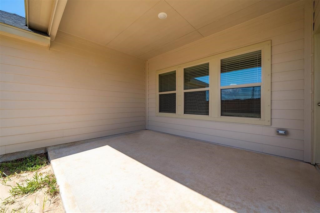 2103 Spring Hollow Drive Baytown, TX 77521 - Photo 25 of 27 a view of an empty room with a window