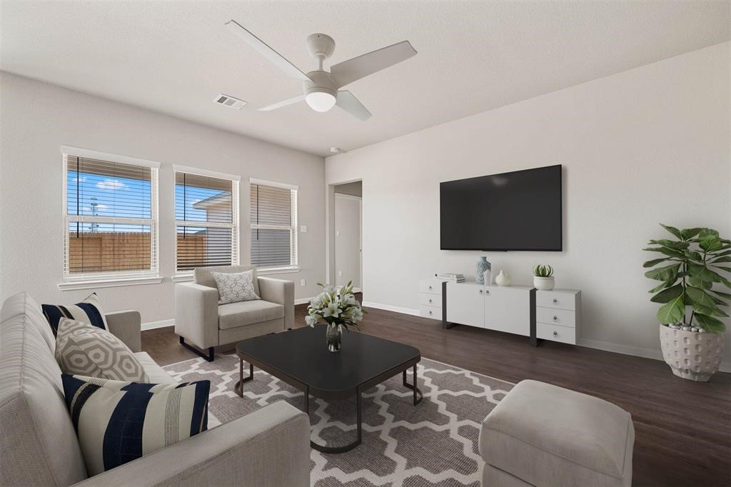 2103 Spring Hollow Drive Baytown, TX 77521 - Photo 3 of 27 a living room with furniture and a flat screen tv