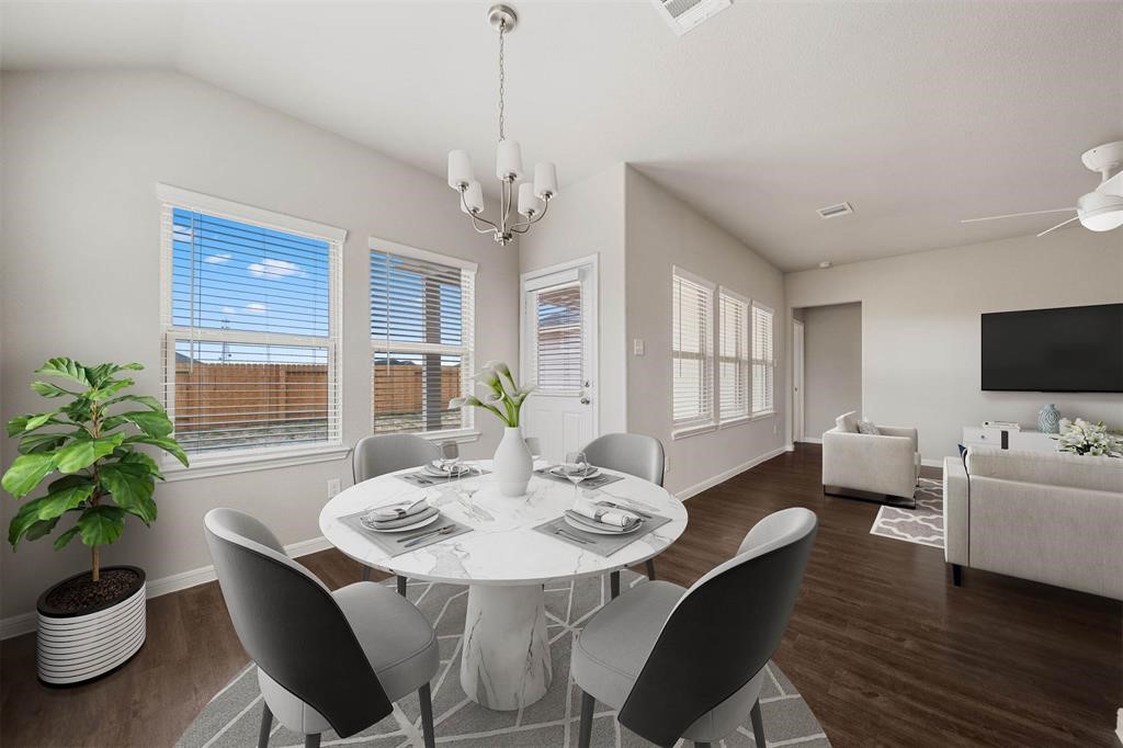 2103 Spring Hollow Drive Baytown, TX 77521 - Photo 7 of 27 a view of a dining room with furniture window and wooden floor