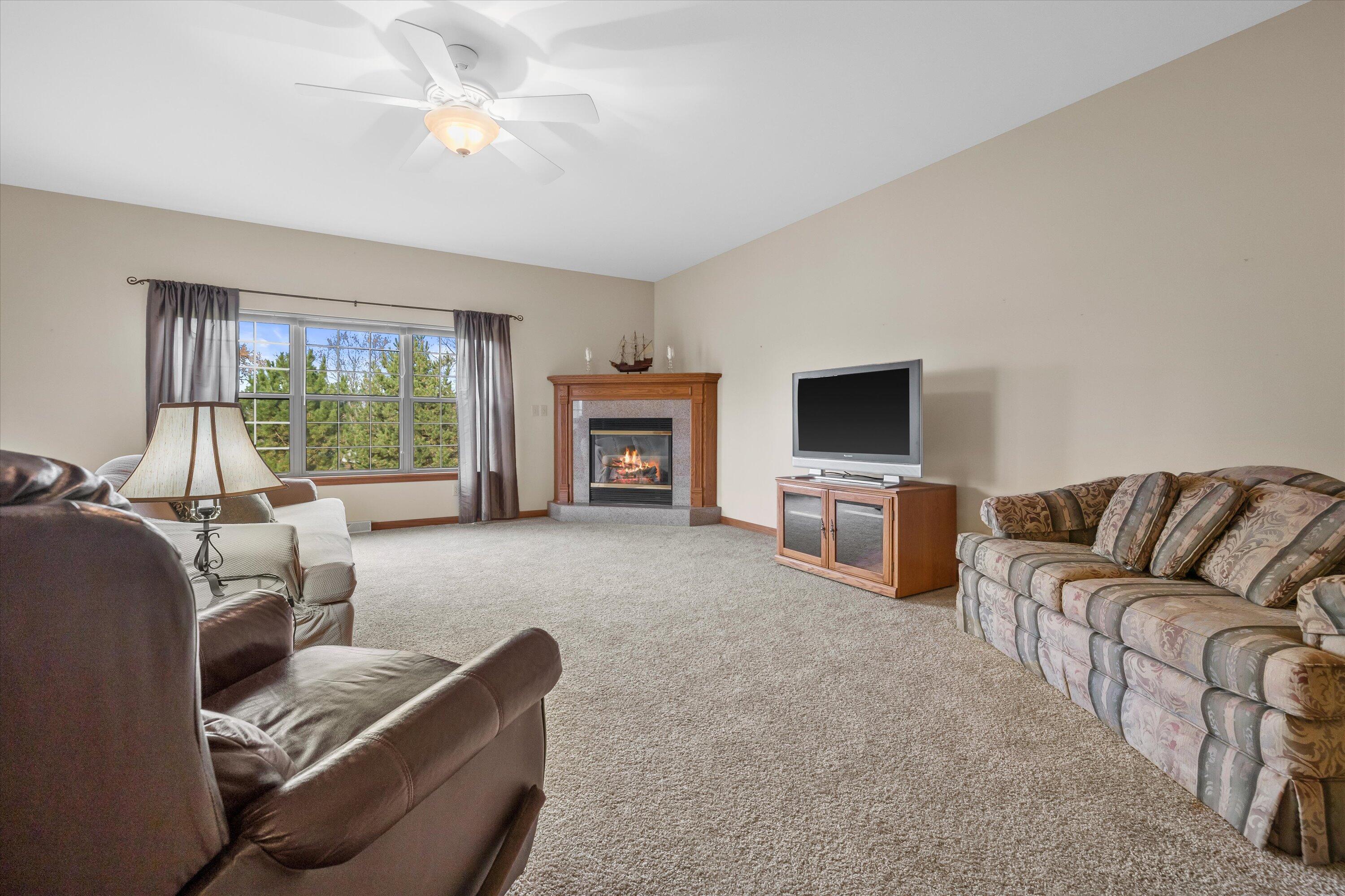 285 Cardinal Ridge Drive Pewaukee, WI 53072 - Photo 17 of 49 One of 2 family rooms. This one offers a fireplace.
