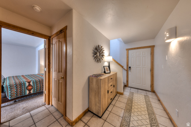 3461 Westwater Road, Unit 6 Moab, UT 84532 - Photo 6 of 33 Hallway with light tile patterned flooring and baseboards
