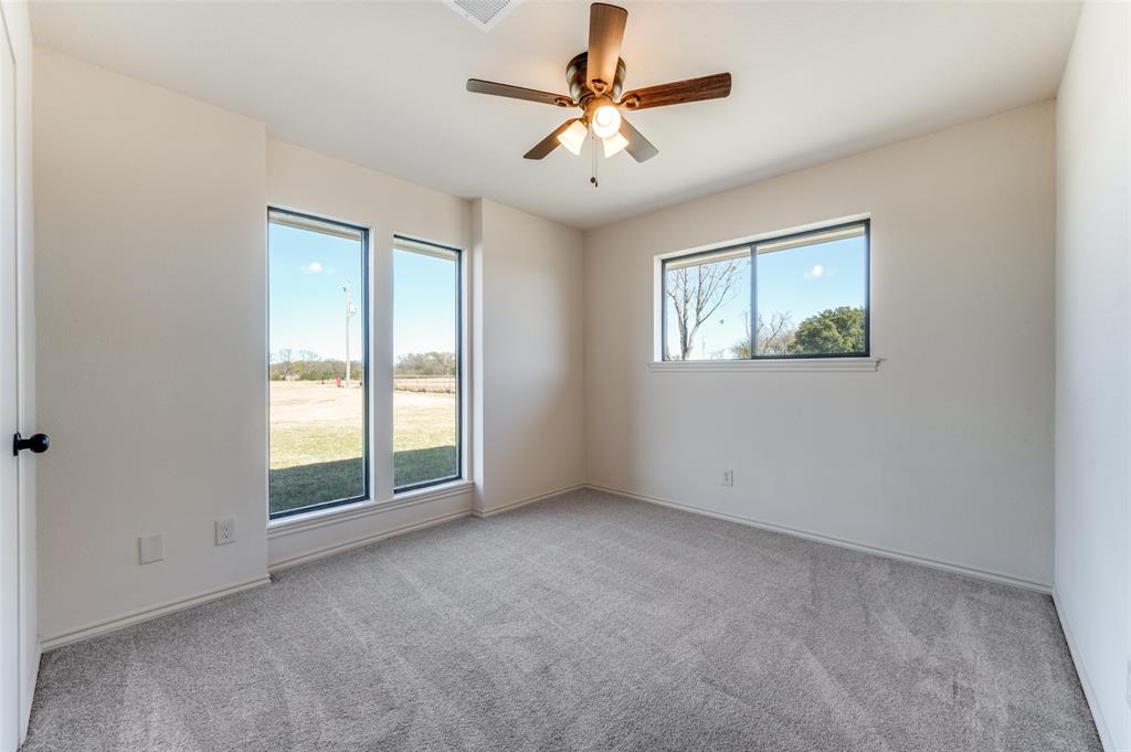 10422 Strittmatter Road Pilot Point, TX 76258 - Photo 13 of 30 a view of an empty room with a window