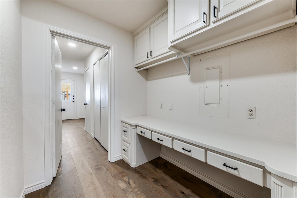 10422 Strittmatter Road Pilot Point, TX 76258 - Photo 16 of 30 a view of a hallway with wooden floor