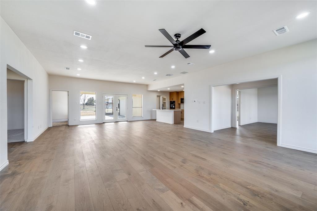 10422 Strittmatter Road Pilot Point, TX 76258 - Photo 5 of 30 a view of empty room with wooden floor