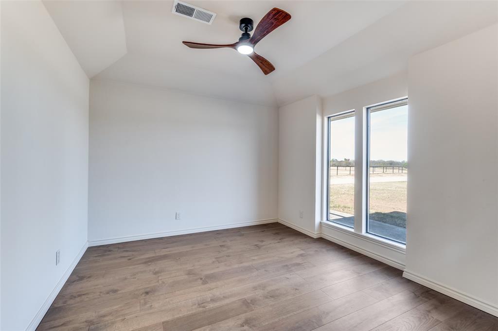 10422 Strittmatter Road Pilot Point, TX 76258 - Photo 7 of 30 an empty room with windows and fan