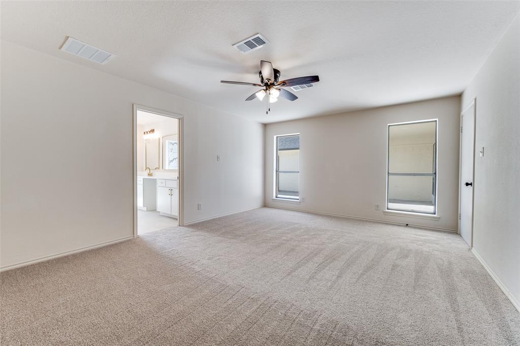 10422 Strittmatter Road Pilot Point, TX 76258 - Photo 8 of 30 a view of an empty room with a ceiling fan