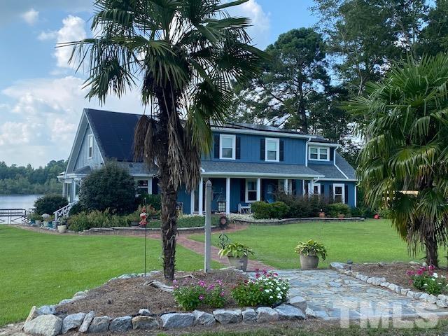 3614 Holly Grove Road Benson, NC 27504 - Photo 1 of 30 a front view of house with yard and green space