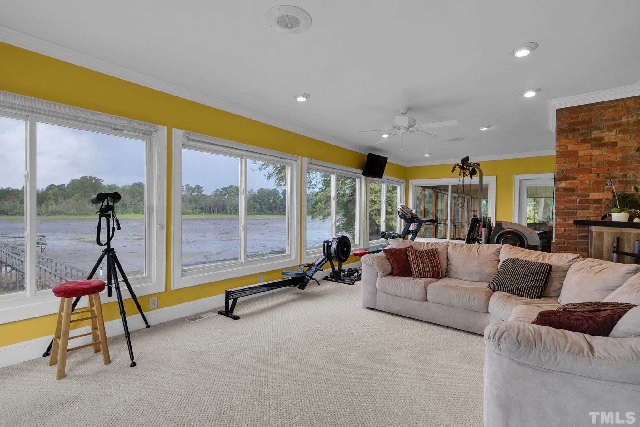 3614 Holly Grove Road Benson, NC 27504 - Photo 15 of 30 a living room with furniture gym equipment and a view of living room