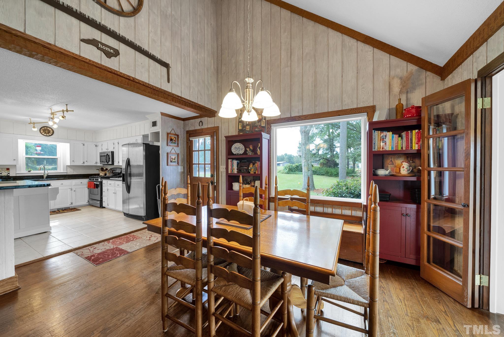 3614 Holly Grove Road Benson, NC 27504 - Photo 16 of 30 a view of a dining room with furniture window and wooden floor