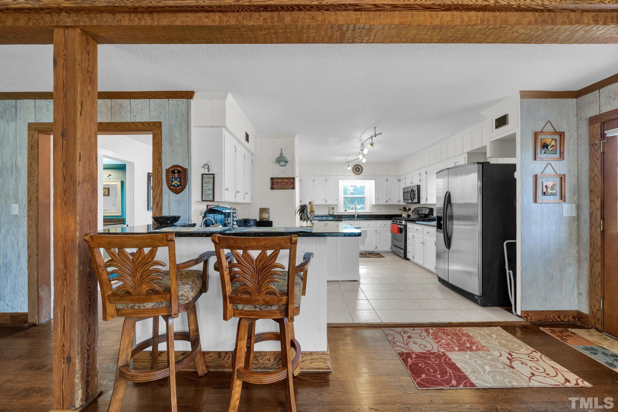 3614 Holly Grove Road Benson, NC 27504 - Photo 17 of 30 a kitchen with stainless steel appliances granite countertop a refrigerator a stove and a sink