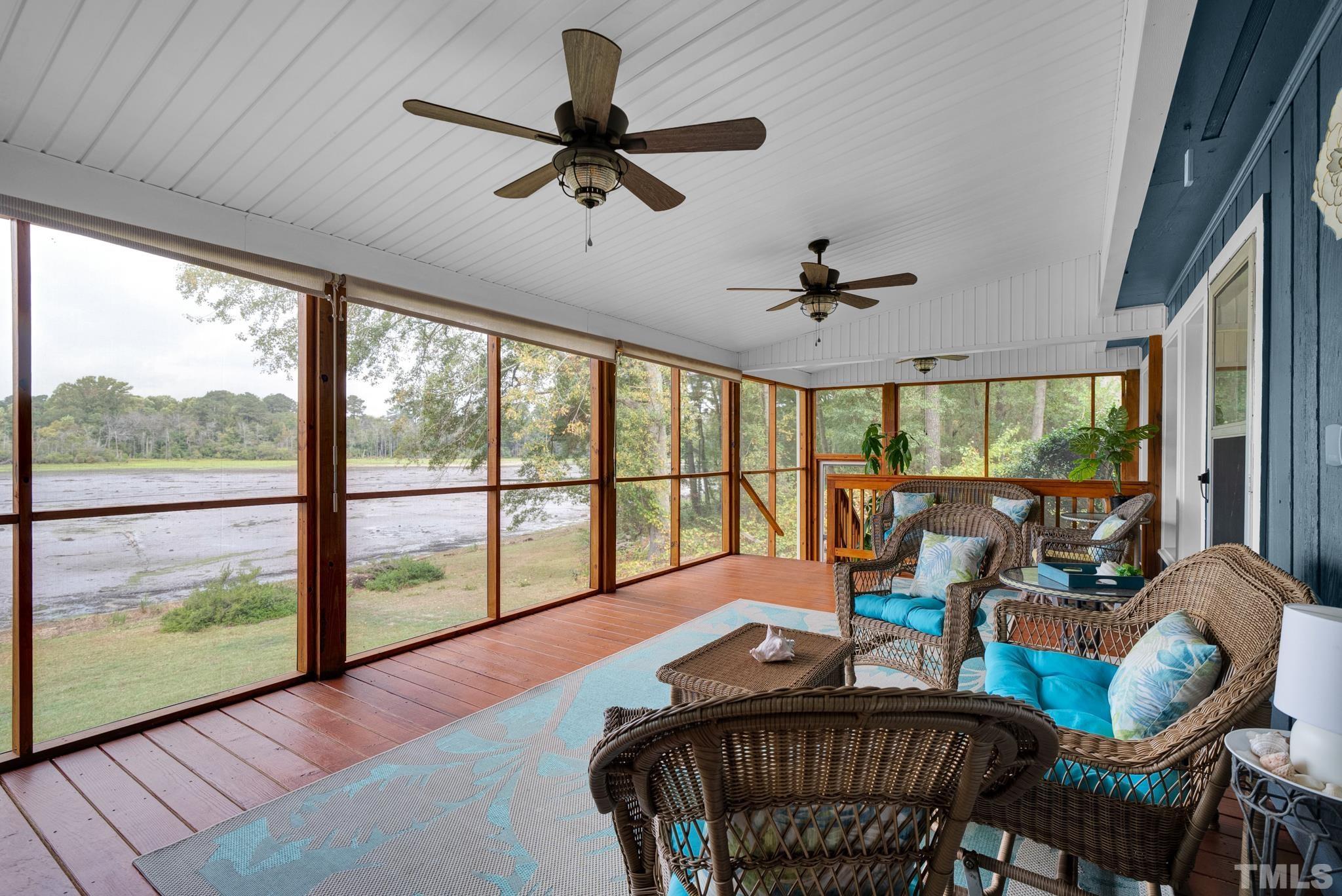 3614 Holly Grove Road Benson, NC 27504 - Photo 21 of 30 a living room with furniture floor to ceiling window and a table