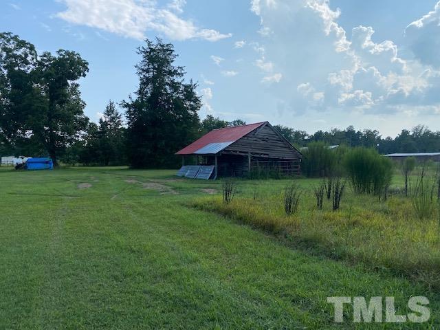 3614 Holly Grove Road Benson, NC 27504 - Photo 23 of 30 a view of a garden with a lake
