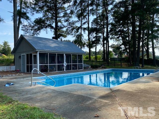 3614 Holly Grove Road Benson, NC 27504 - Photo 25 of 30 a view of a house with backyard and tree