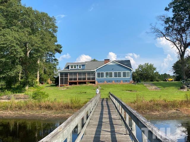 3614 Holly Grove Road Benson, NC 27504 - Photo 26 of 30 a view of a house with a yard