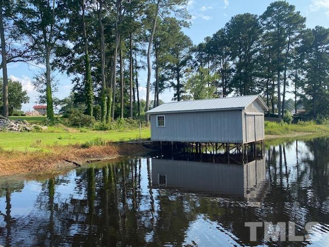 3614 Holly Grove Road Benson, NC 27504 - Photo 29 of 30 a view of a house with backyard and sitting area