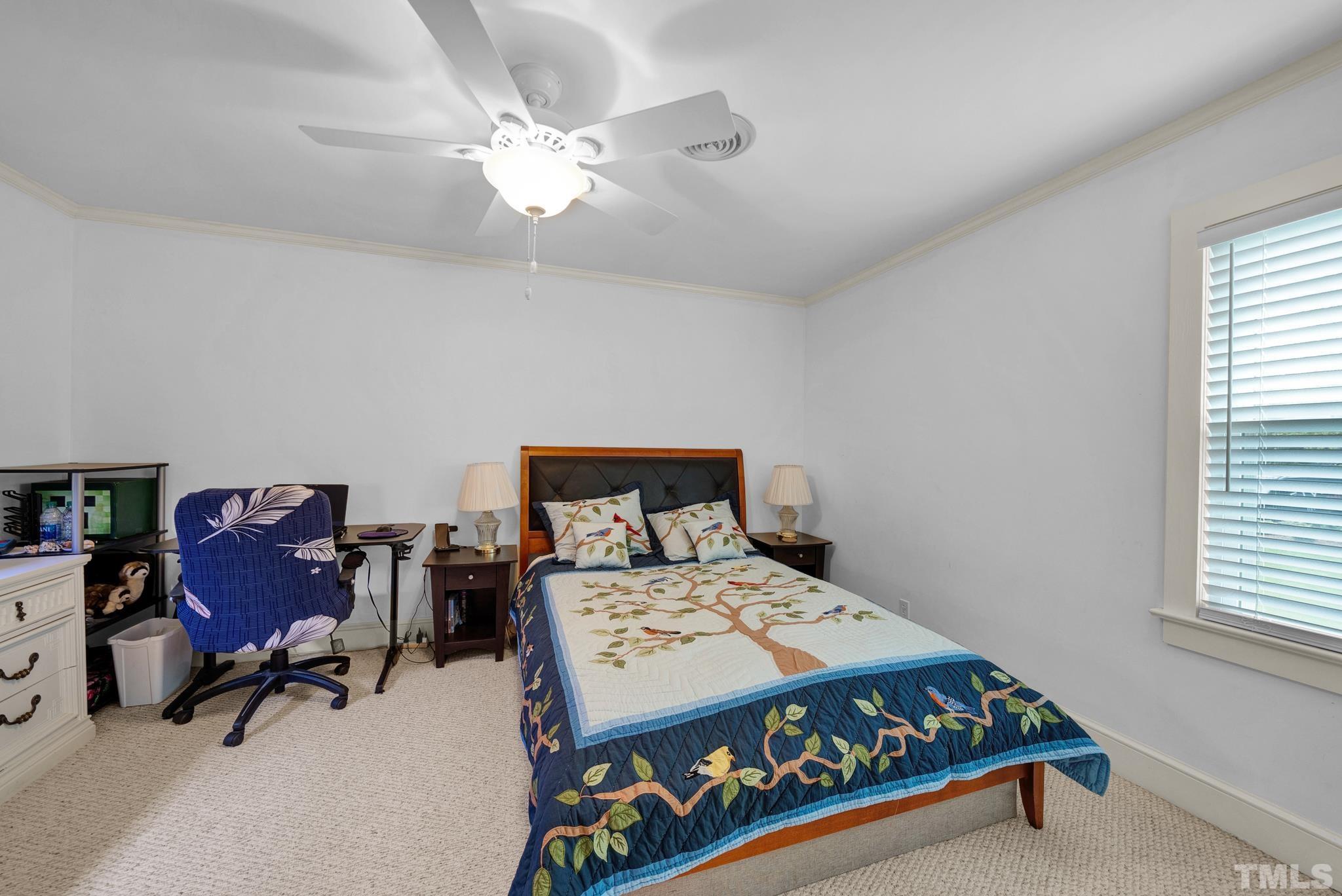 3614 Holly Grove Road Benson, NC 27504 - Photo 5 of 30 a bed sitting in a bedroom next to a window