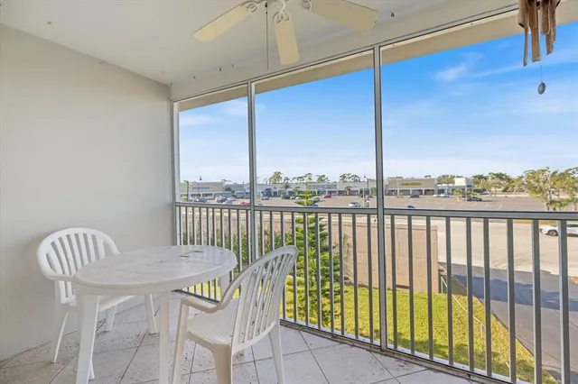 a view of a dining room with furniture and a chandelier