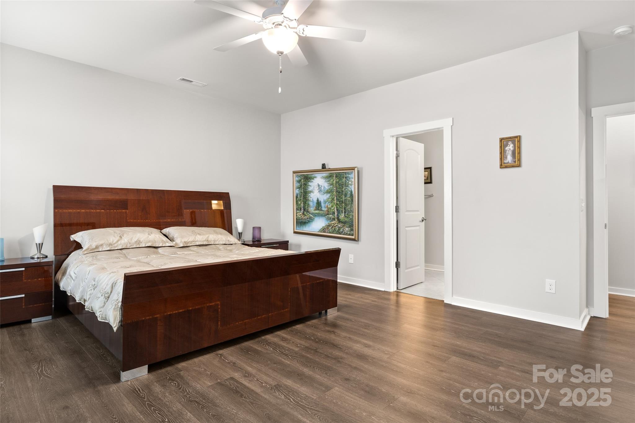 23115 Goose Down Lane Lancaster, SC 29720 - Photo 12 of 45 a bedroom with a bed and wooden floor