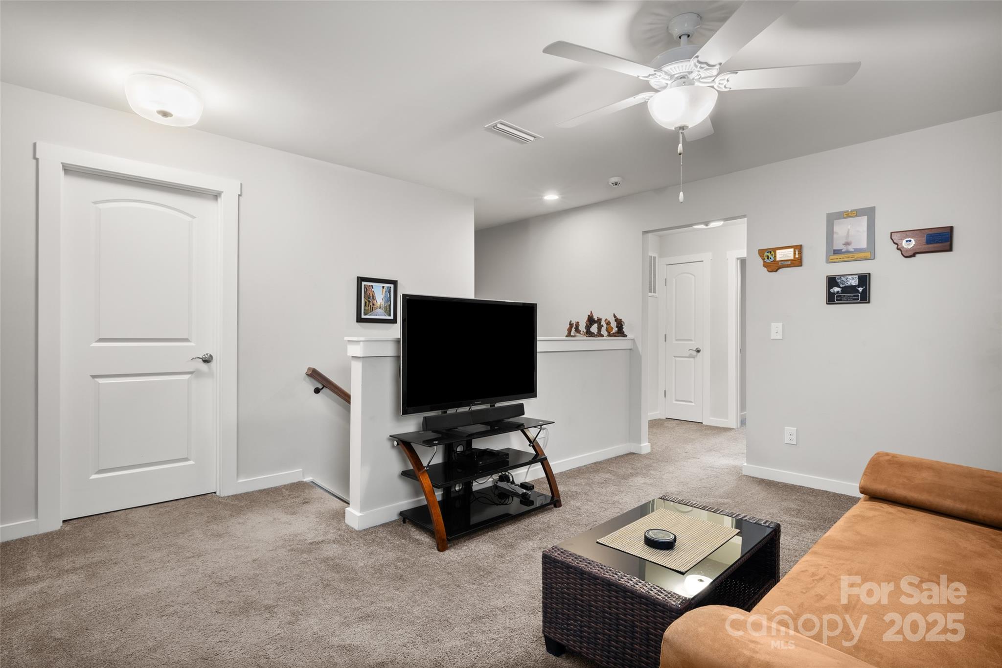 23115 Goose Down Lane Lancaster, SC 29720 - Photo 20 of 45 a living room with furniture and a flat screen tv