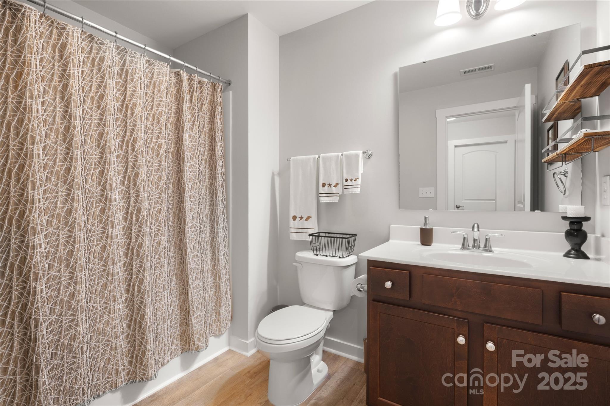 23115 Goose Down Lane Lancaster, SC 29720 - Photo 23 of 45 a bathroom with a toilet a sink and a mirror