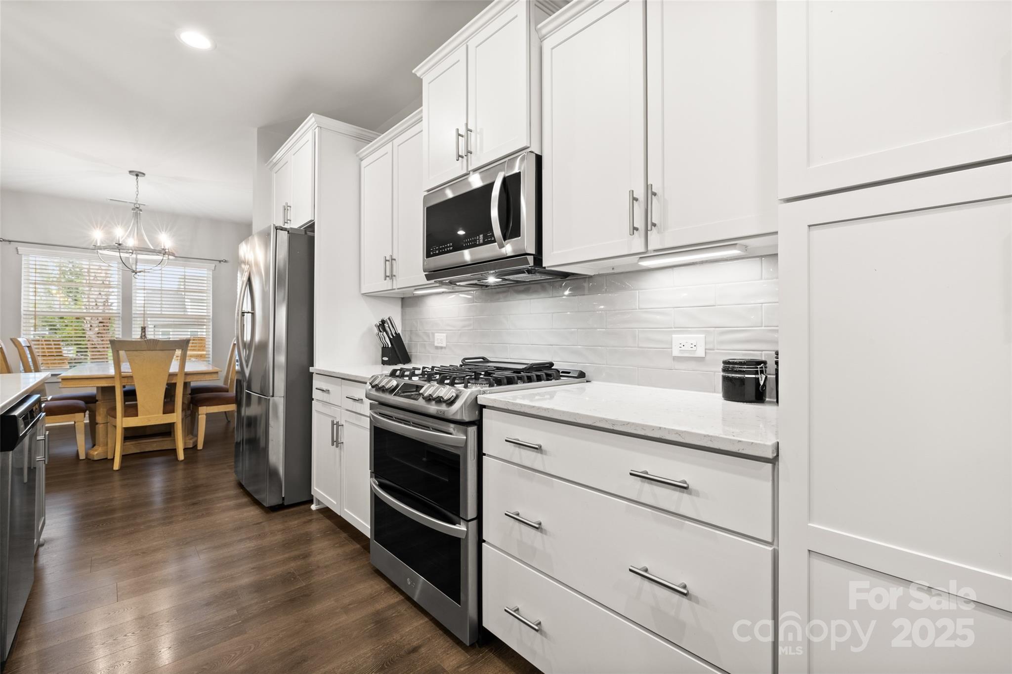 23115 Goose Down Lane Lancaster, SC 29720 - Photo 6 of 45 a kitchen with stainless steel appliances granite countertop a stove a sink and a microwave