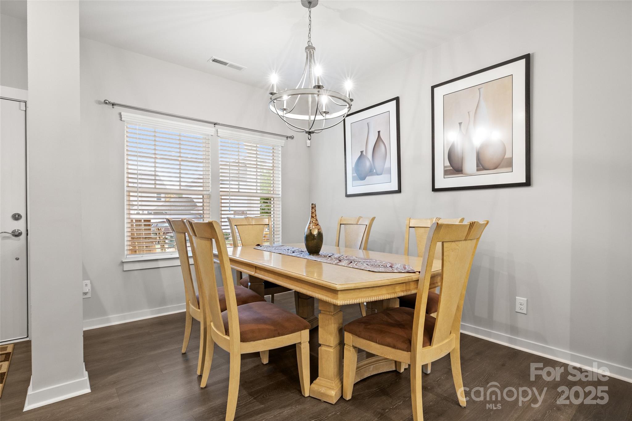 23115 Goose Down Lane Lancaster, SC 29720 - Photo 7 of 45 a view of a dining room with furniture window and wooden floor