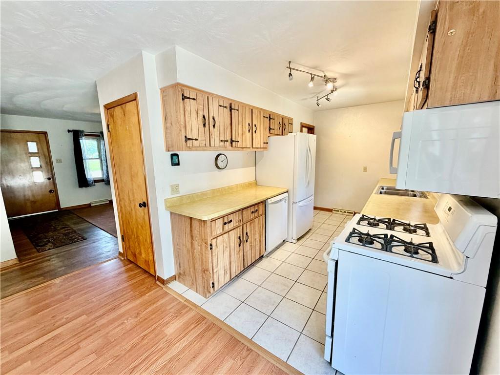121 Kemar Drive Butler, PA 16002 - Photo 7 of 31 a kitchen with stainless steel appliances a refrigerator and a stove