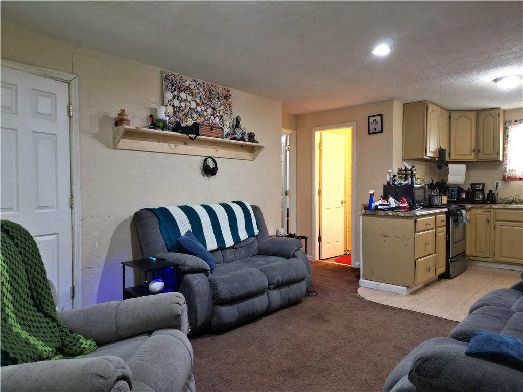 1119 Layton Road Butler, PA 16001 - Photo 7 of 25 a living room with furniture kitchen view and a window