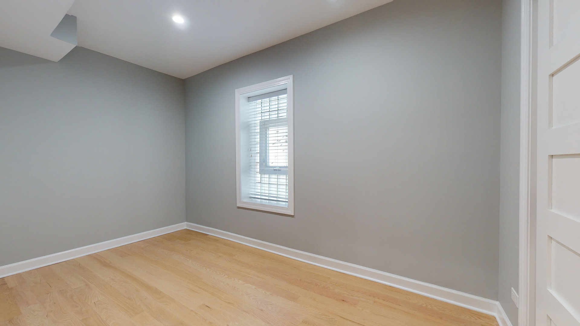 1543 West George Street, Unit 1 Chicago, IL 60657 - Photo 14 of 18 an empty room with a window