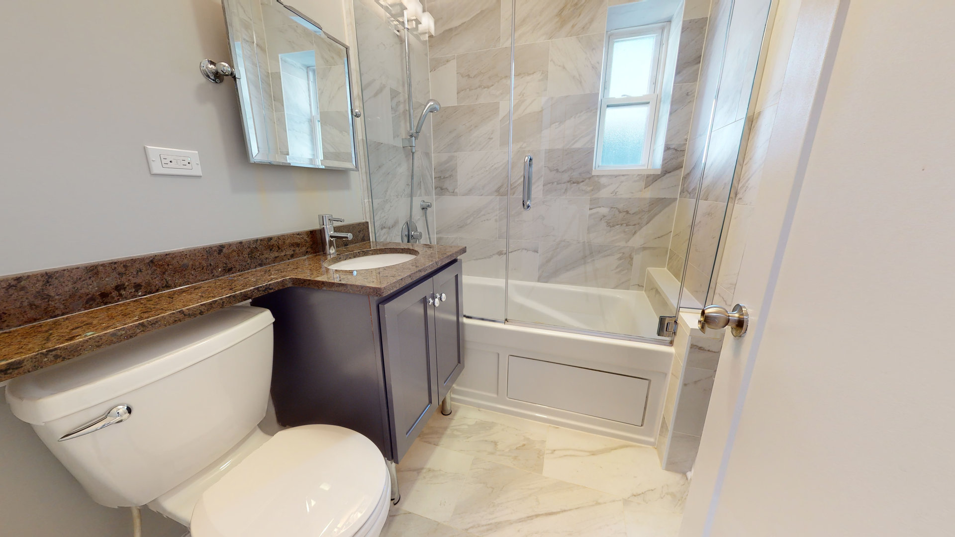 1543 West George Street, Unit 1 Chicago, IL 60657 - Photo 15 of 18 a bathroom with a granite countertop sink toilet and shower