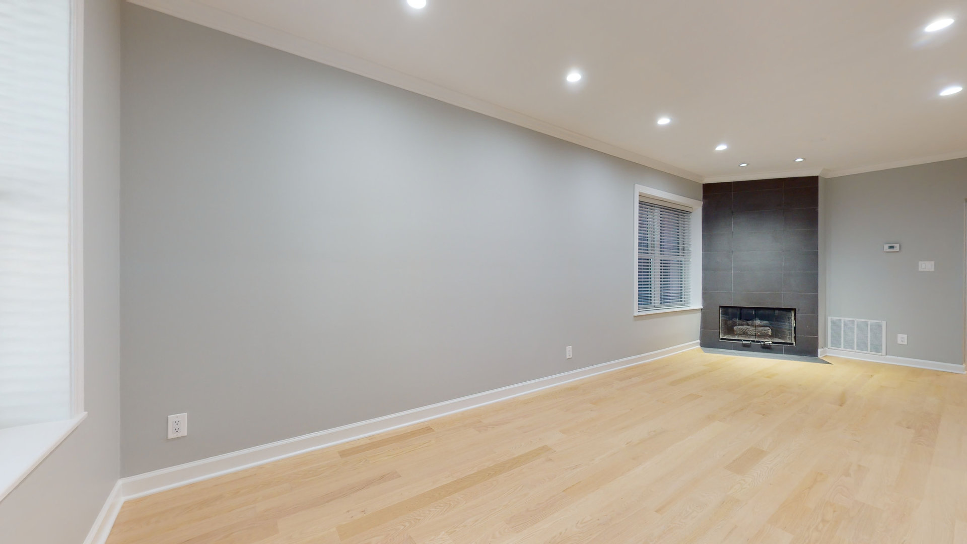 1543 West George Street, Unit 1 Chicago, IL 60657 - Photo 4 of 18 a view of an empty room with a fireplace