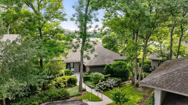 an aerial view of a house with yard and outdoor seating