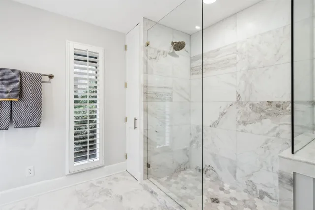 a spacious bathroom with a sink and a mirror