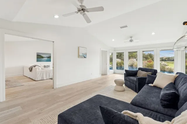 an aerial view of a house with garden space and street view
