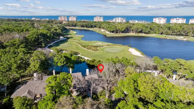 an aerial view of a houses with a yard