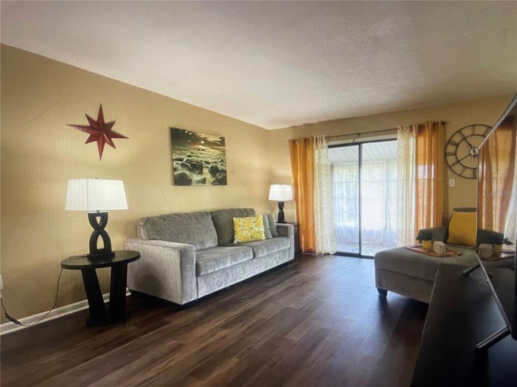 757 Midway Drive, Unit B Ocala, FL 34472 - Photo 13 of 26 a living room with furniture and a lamp