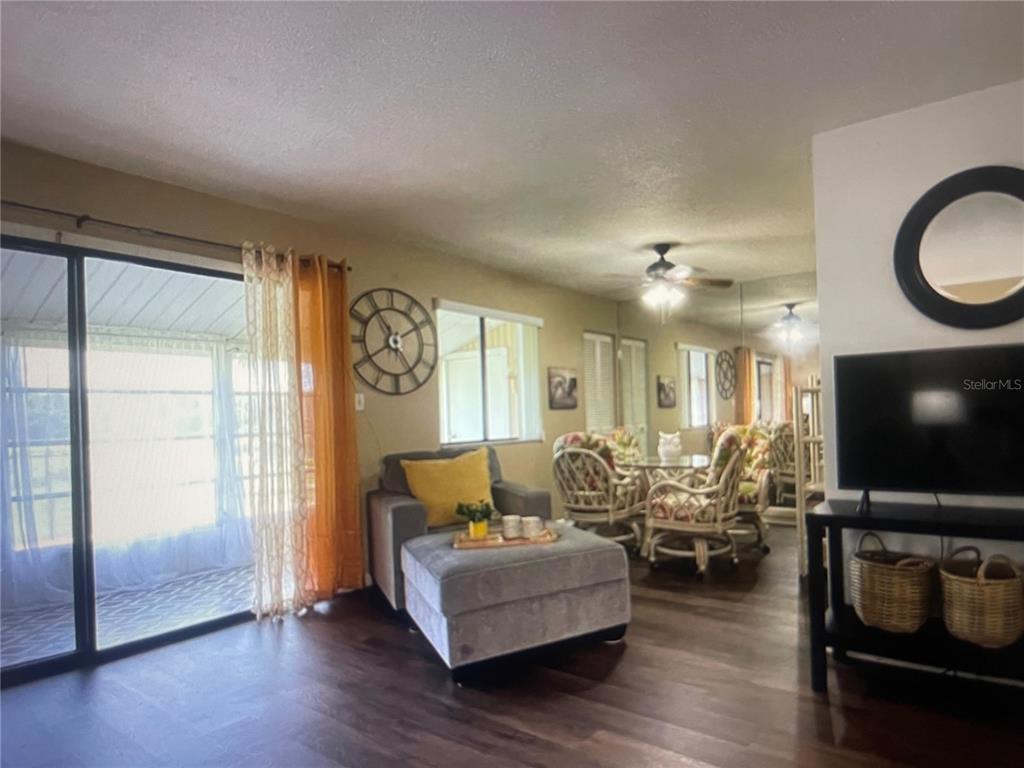 757 Midway Drive, Unit B Ocala, FL 34472 - Photo 14 of 26 a living room with furniture and a flat screen tv