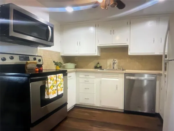 a kitchen with a sink and cabinets