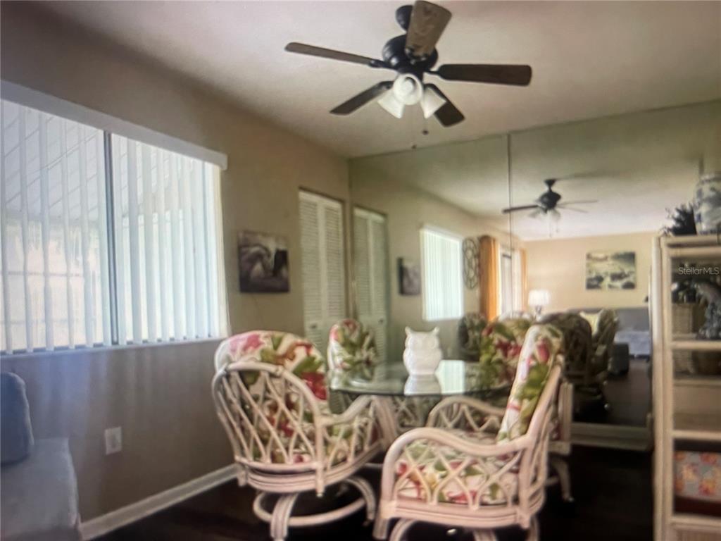 757 Midway Drive, Unit B Ocala, FL 34472 - Photo 19 of 26 a living room with furniture and a chandelier