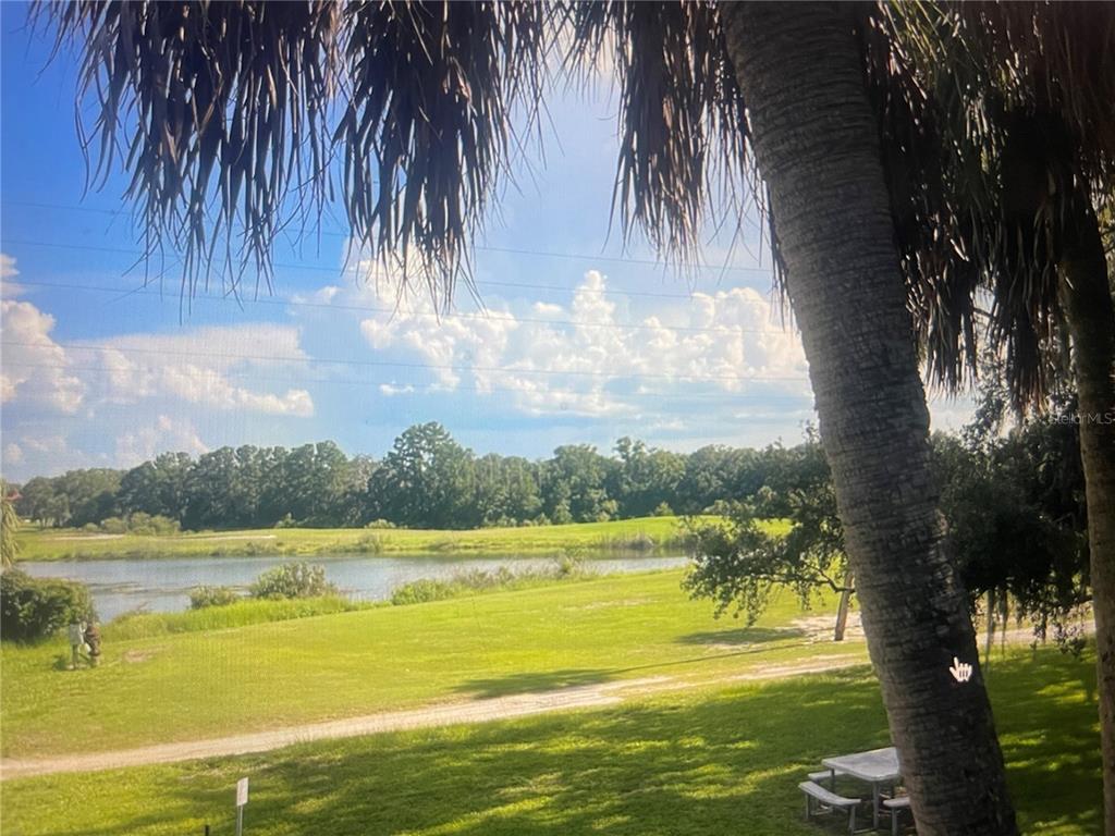 757 Midway Drive, Unit B Ocala, FL 34472 - Photo 3 of 26 a view of a lake with a big yard