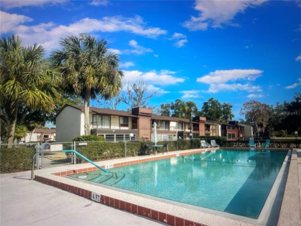 757 Midway Drive, Unit B Ocala, FL 34472 - Photo 4 of 26 a view of a house with pool and a yard