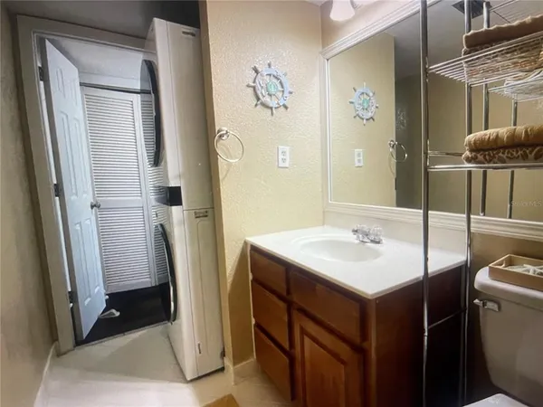 a bathroom with a double vanity sink toilet and shower